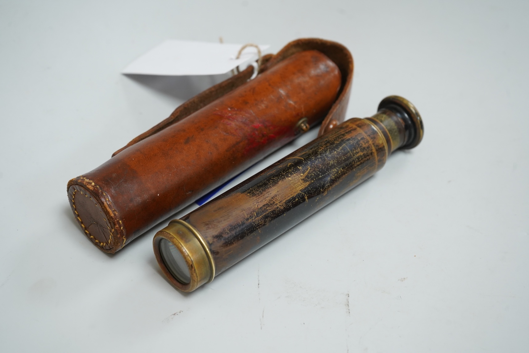 A Pietra Dura inkstand, telescope, cased glass flask and a wood boat model